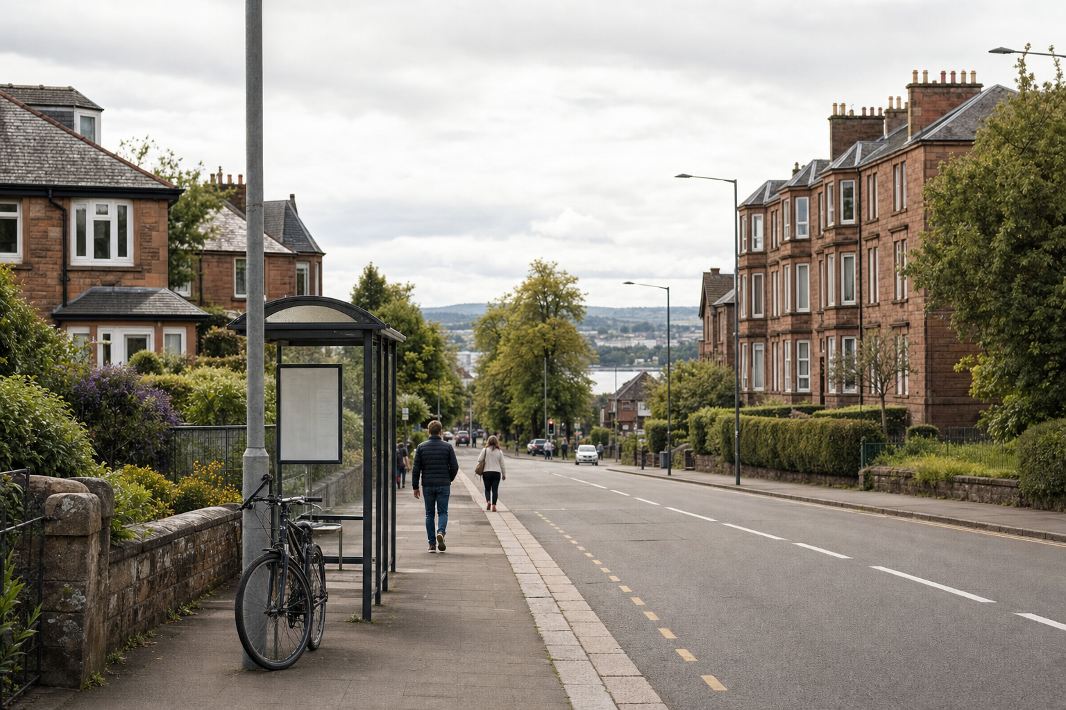 A peaceful street scene shows two people walking on the pavement beside a bicycle and a bus stop.