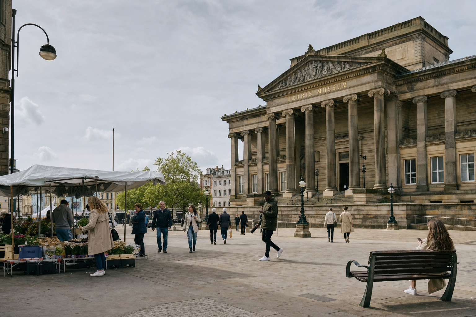 People walking and browsing a flower market stall near a grand columned museum entrance on a cloudy day.