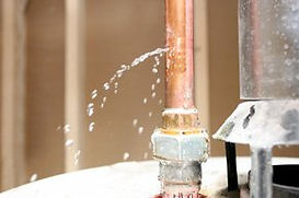 Water is bursting out of a copper pipe