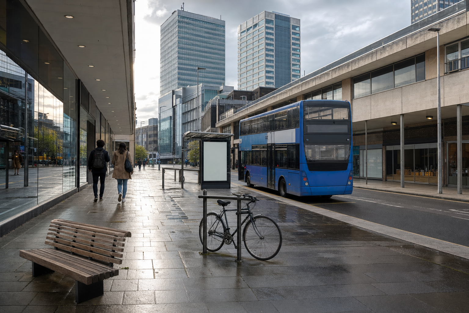 Urban street scene with a blue double-decker bus, a bicycle, and people walking on the pavement.