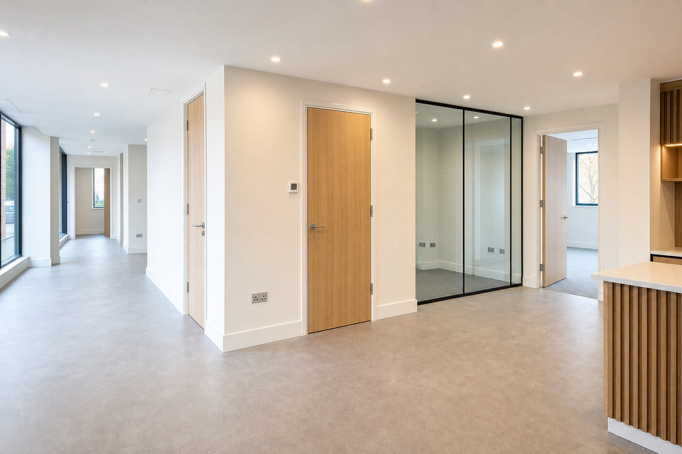 Modern, spacious interior with cream walls, wooden doors, large windows, and a partitioned glass area.