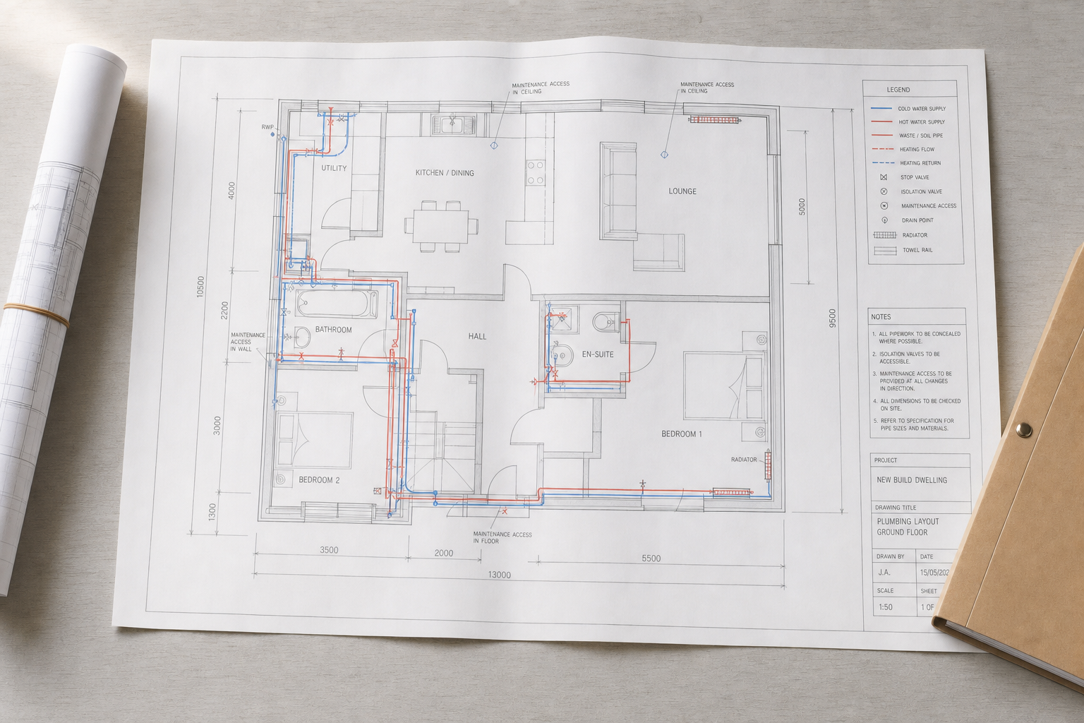Detailed ground floor plumbing layout plan with annotations and a rolled-up blueprint beside it.