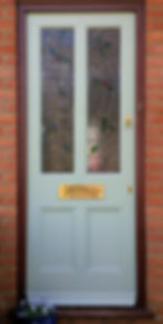 Front door incorporating customer's stained glass work