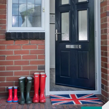 Modern home with black door and red bricks