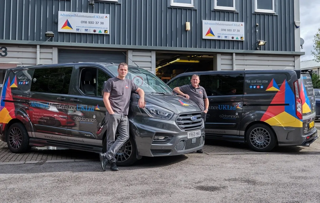 Advanced Maintenance engineers with company vehicles outside head office