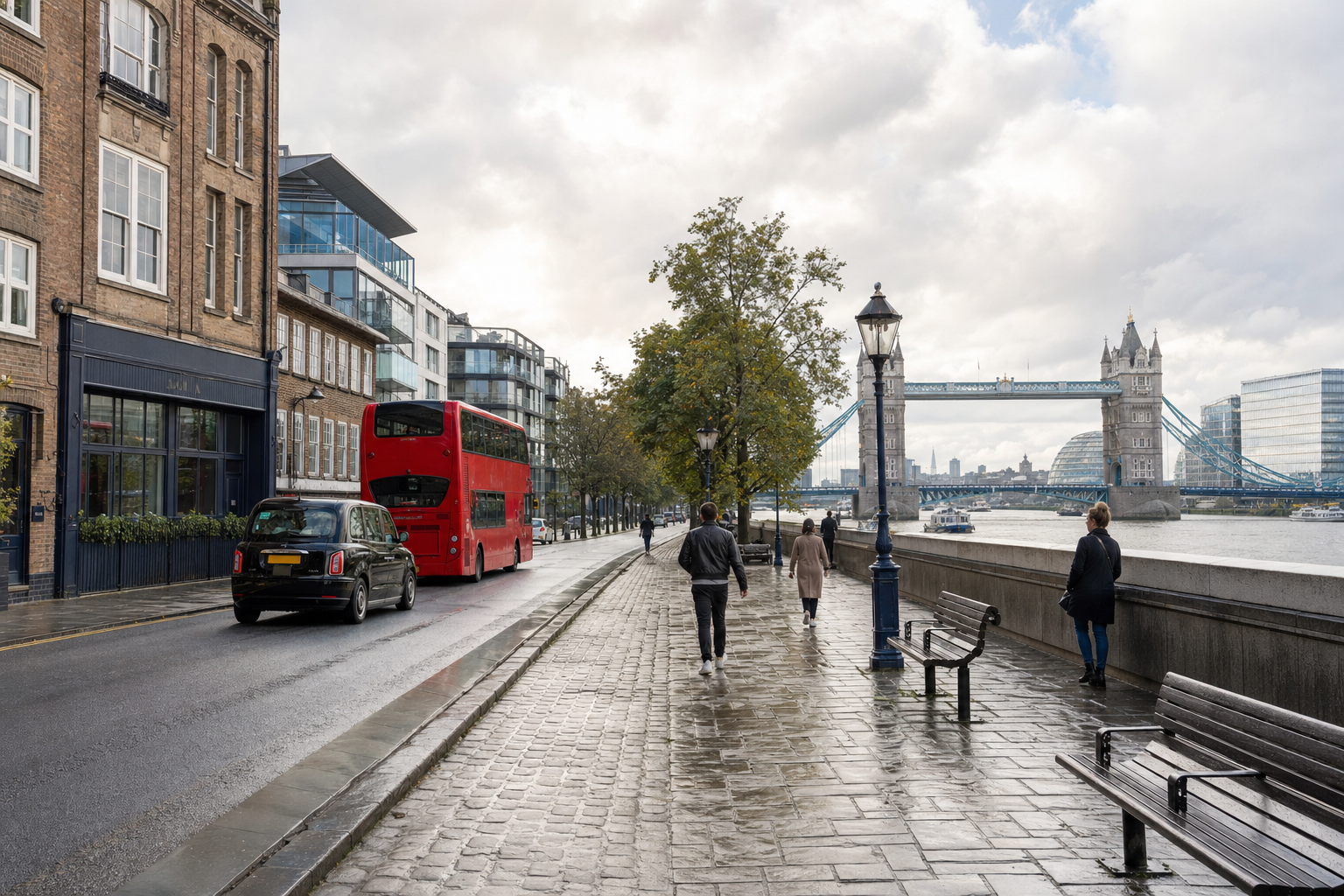 A red double-decker bus and pedestrians near Tower Bridge on a cloudy day in London.