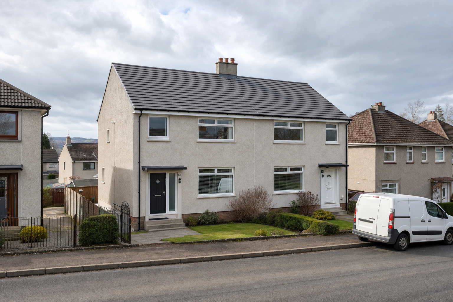 A semi-detached house with a white van parked in front, set in a suburban neighbourhood under a cloudy sky.