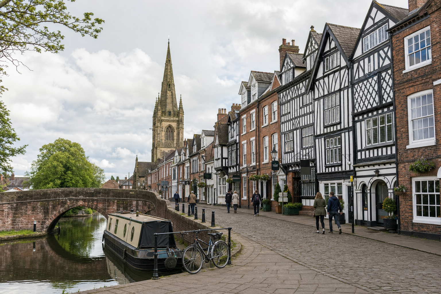 Canal boating scene with Tudor-style buildings and a church spire in a quaint English town.