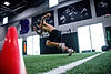 professional athlete speed training at Barwis on turf during the NFL Combine program
