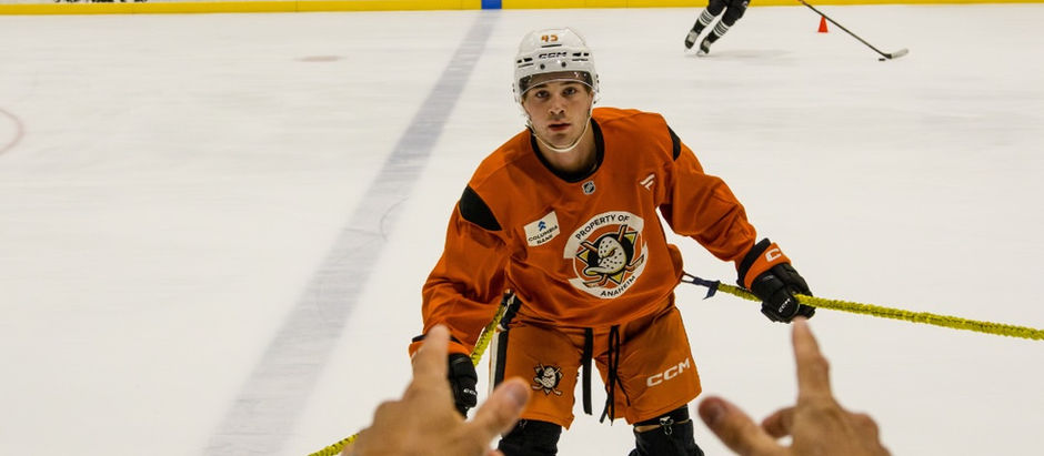 Barwis trainer coaching a hockey player on the ice