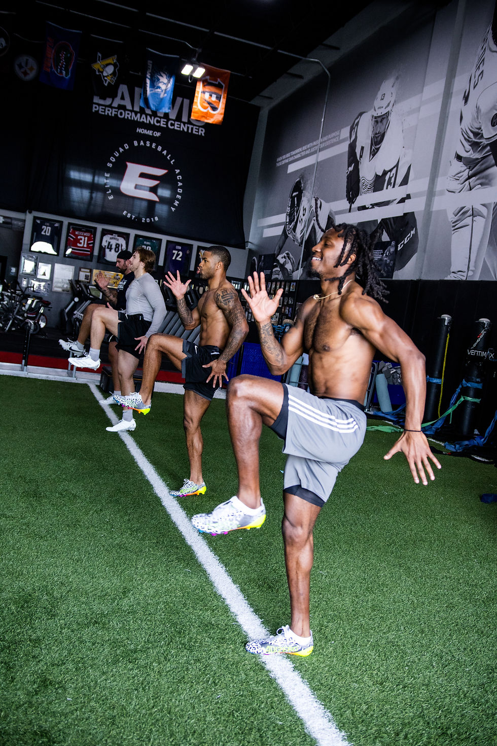 Four pro athletes doing strength and speed training at Barwis during the NFL Combine progr