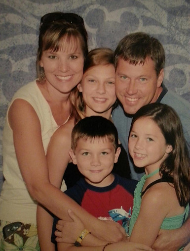 The owner of Carolina Sunrooms with his wife and three children.