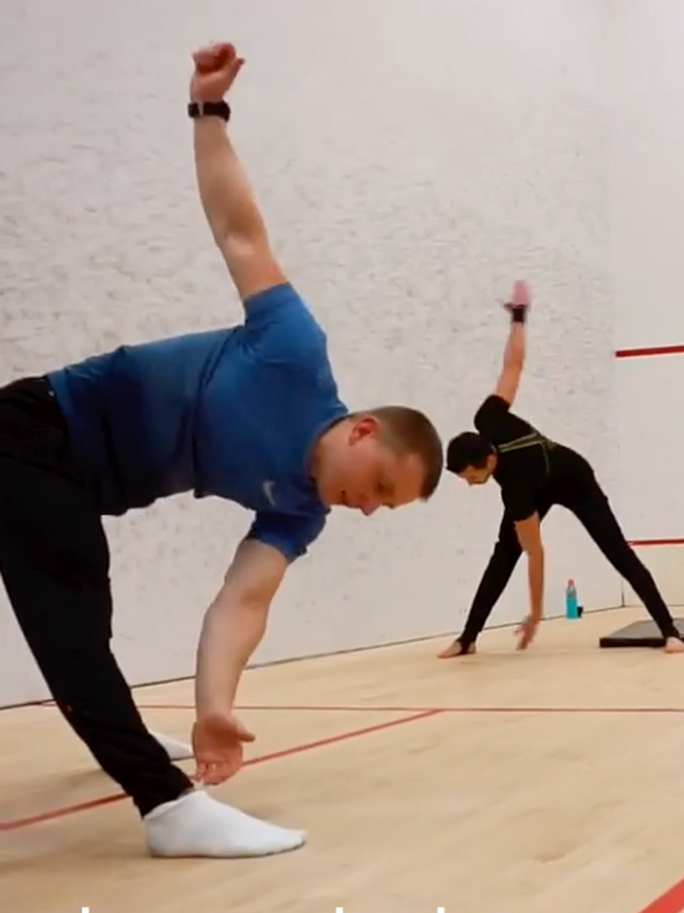 Trainer Maxim performing a warm up with his students during another gymnastics workshop.
