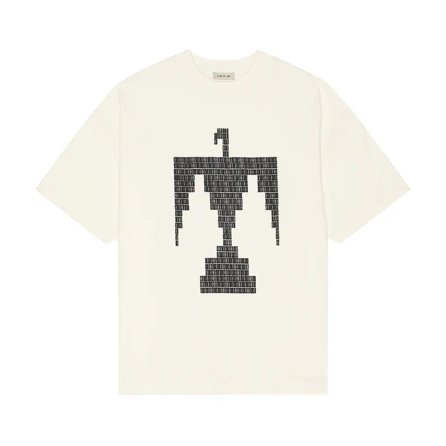 Fear of God Thunderbird Cream T-shirt laid flat front view featuring pixel style Thunderbird graphic
