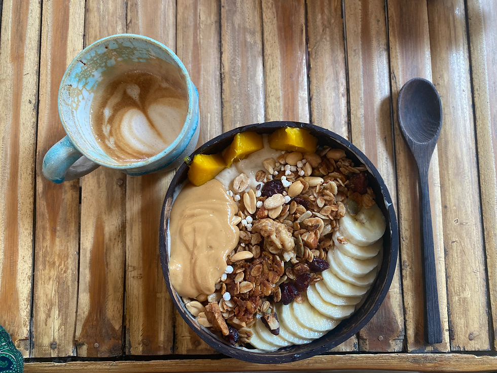 A smoothiebowl with cappucino from above