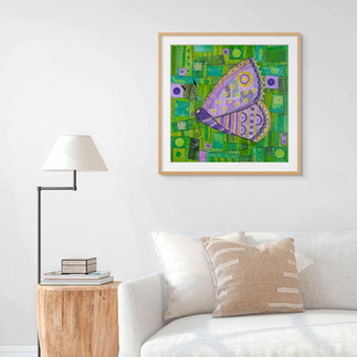 lillac butterfly against a green background wall art above a couch