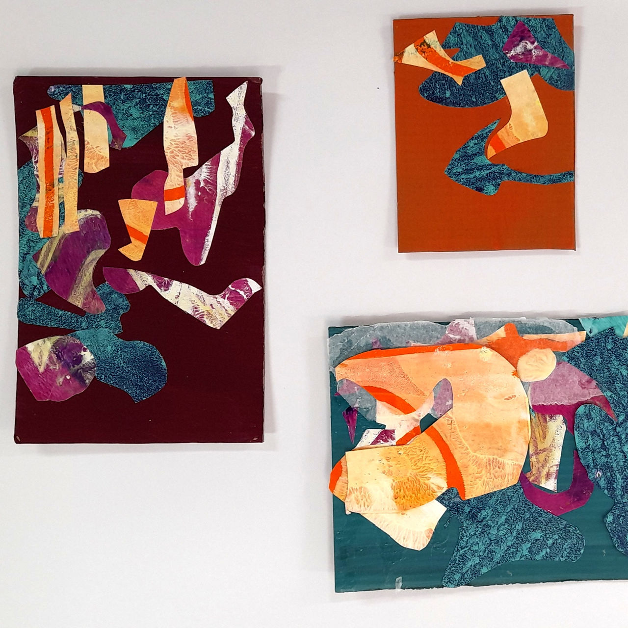 3 small abstract mixed media artworks in magenta blue and yellow organic shapes