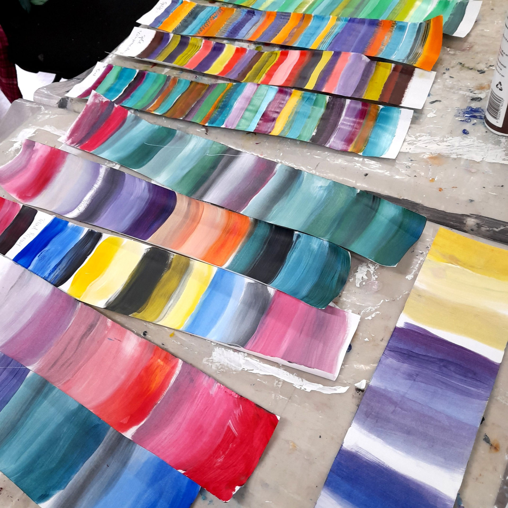 painted paper strips in different colours