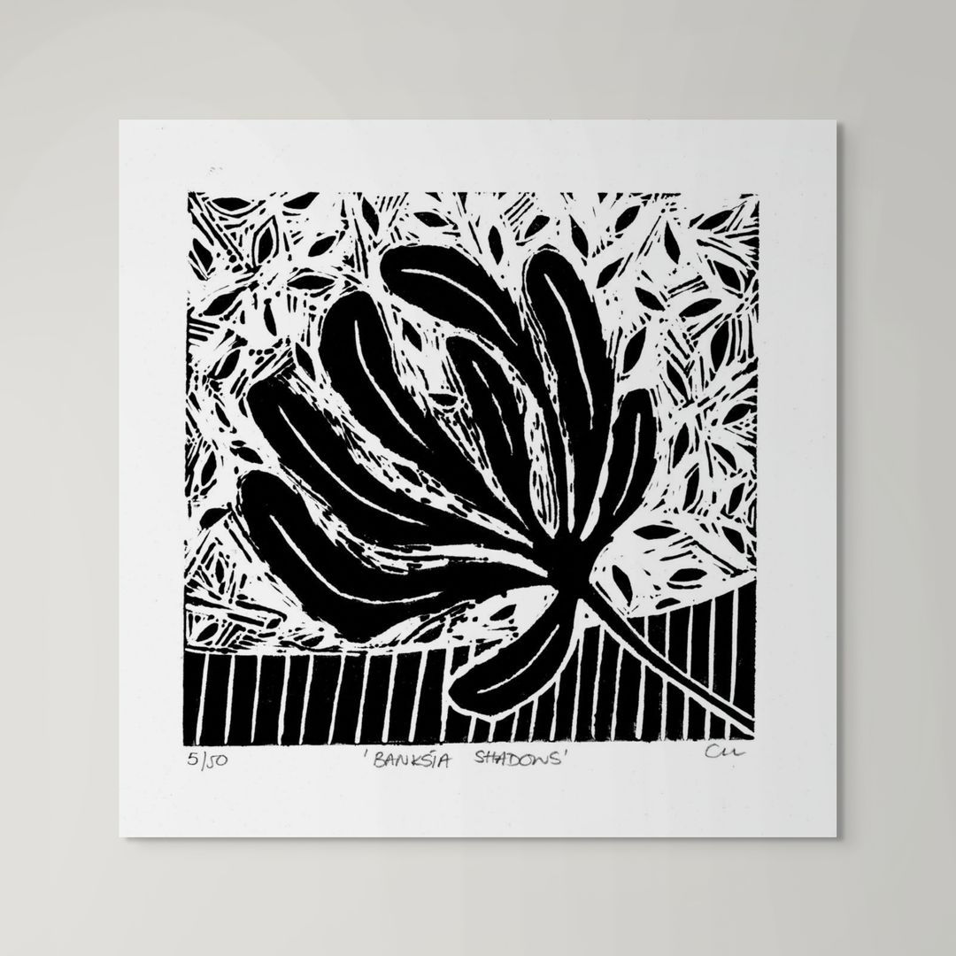 abstract botanical lino print of a banksia leaf in black and white