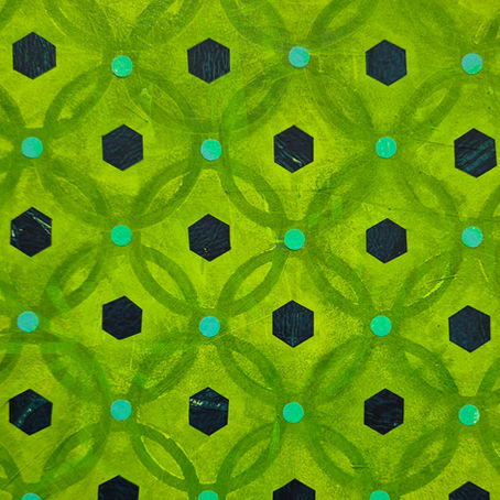 Green pattern with overlapping circles and black hexagons on a vibrant yellow background, creating a geometric, abstract design.