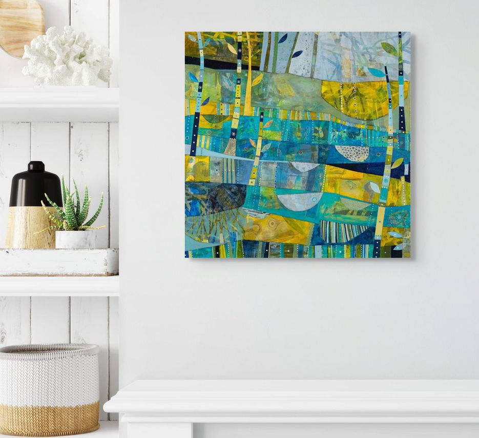 abstract landscape coastal inspired artwork in blue yellow and green framed in a room scene