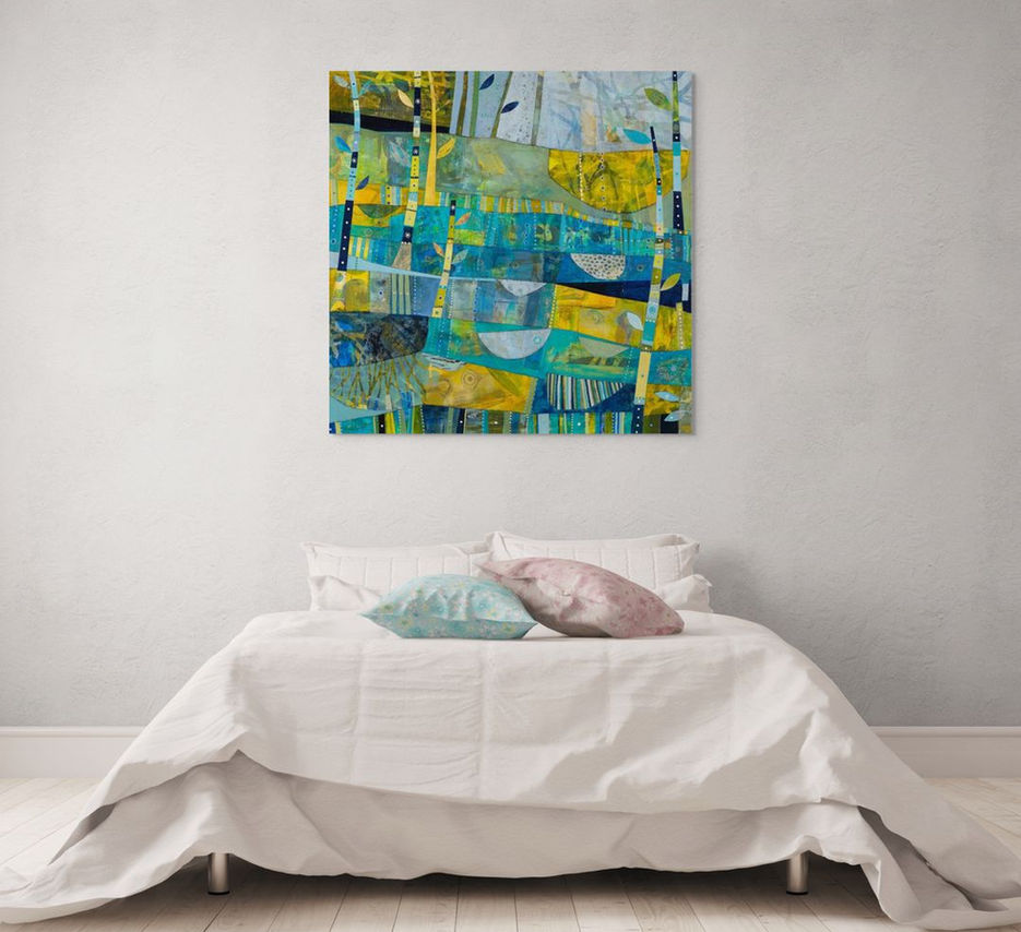 abstract landscape coastal inspired artwork in blue yellow and green framed in a room scene