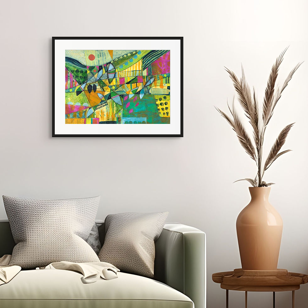 Colorful abstract painting in a black frame on a wall above a beige couch with pillows. A tall vase with dried plants stands on the right.