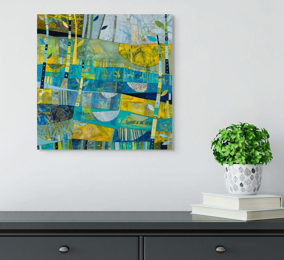 abstract landscape coastal inspired artwork in blue yellow and green framed in a room scene