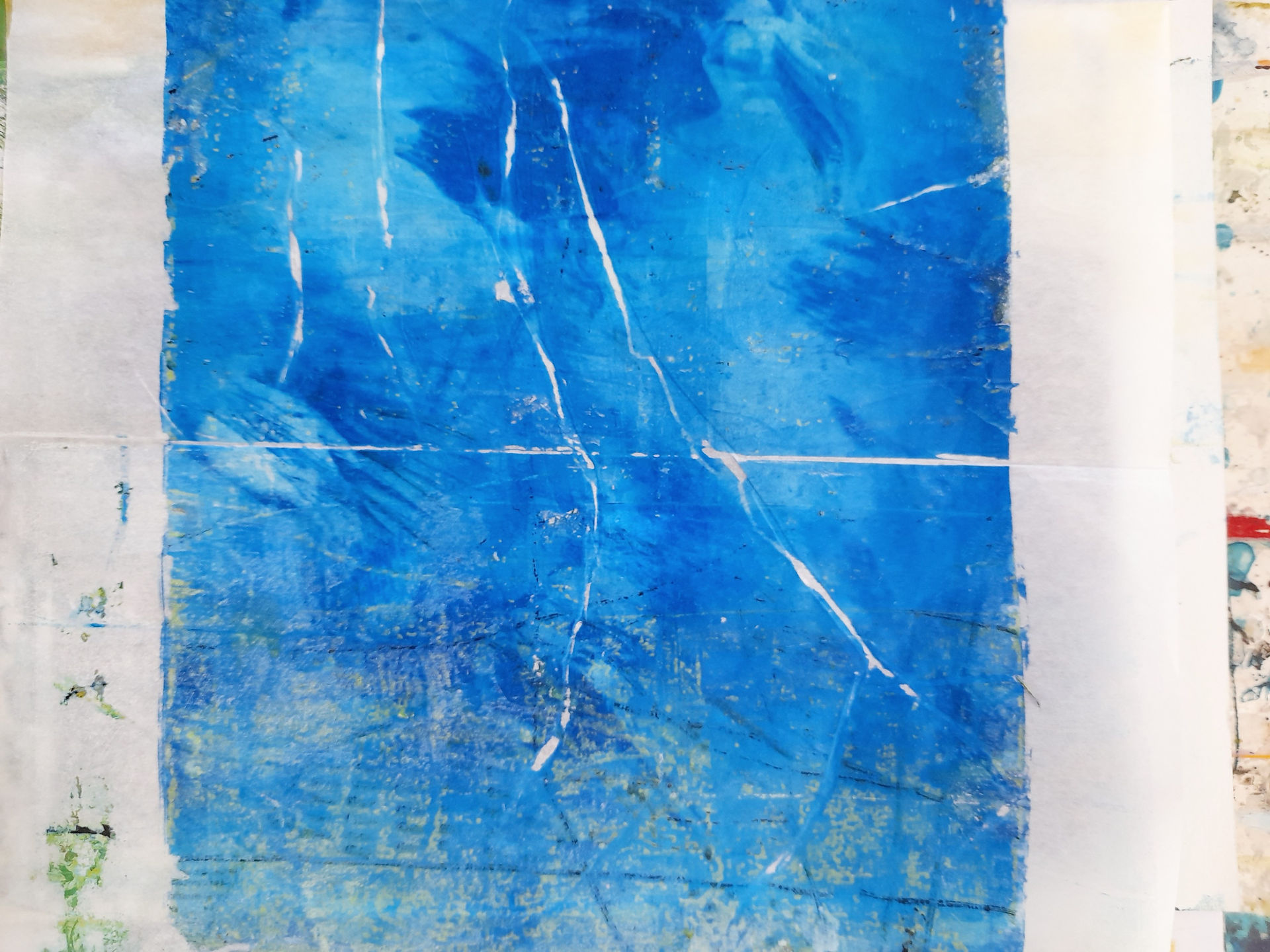 random printed paper with lines and paint in green yellow and blue