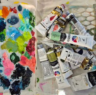 artists palette with paint tubes