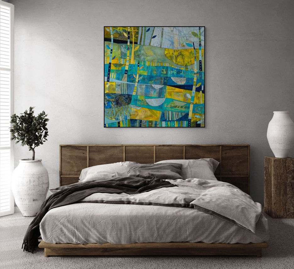 abstract landscape coastal inspired artwork in blue yellow and green framed in a room scene