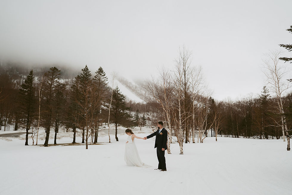 wedding couple exploring the white mountains on elopement day in the winter