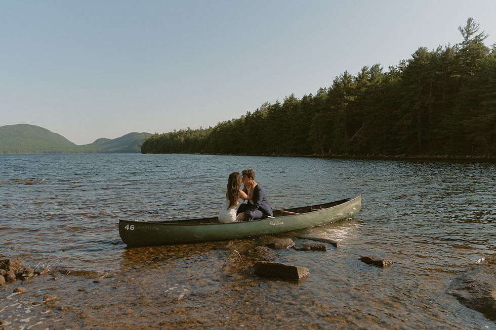 couple canoeing on eagle lake in acadia on elopement day