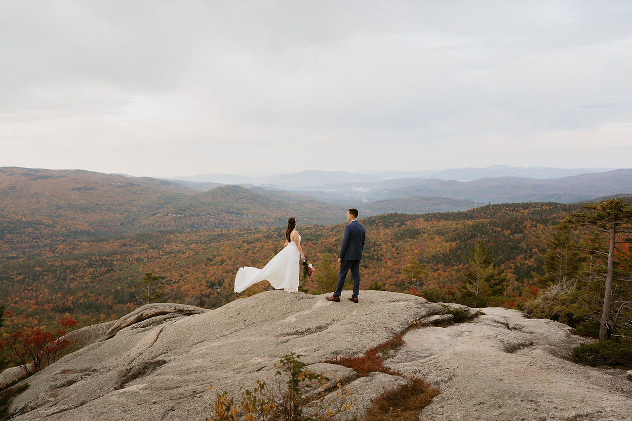Franconia Notch Fall Elopement couple on mountain top in white mountains