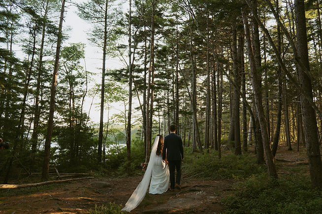 acadia elopement couple walking through the woods
