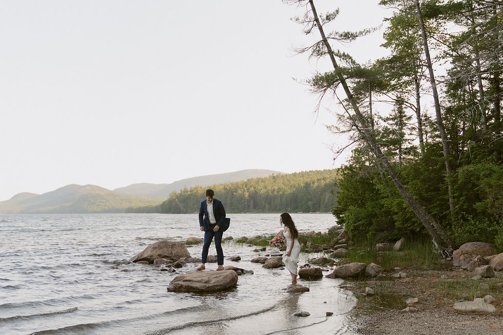 couple canoeing on eagle lake in acadia on elopement day