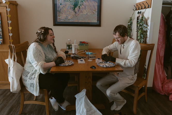 Couple opening oysters on loon mountain elopement day