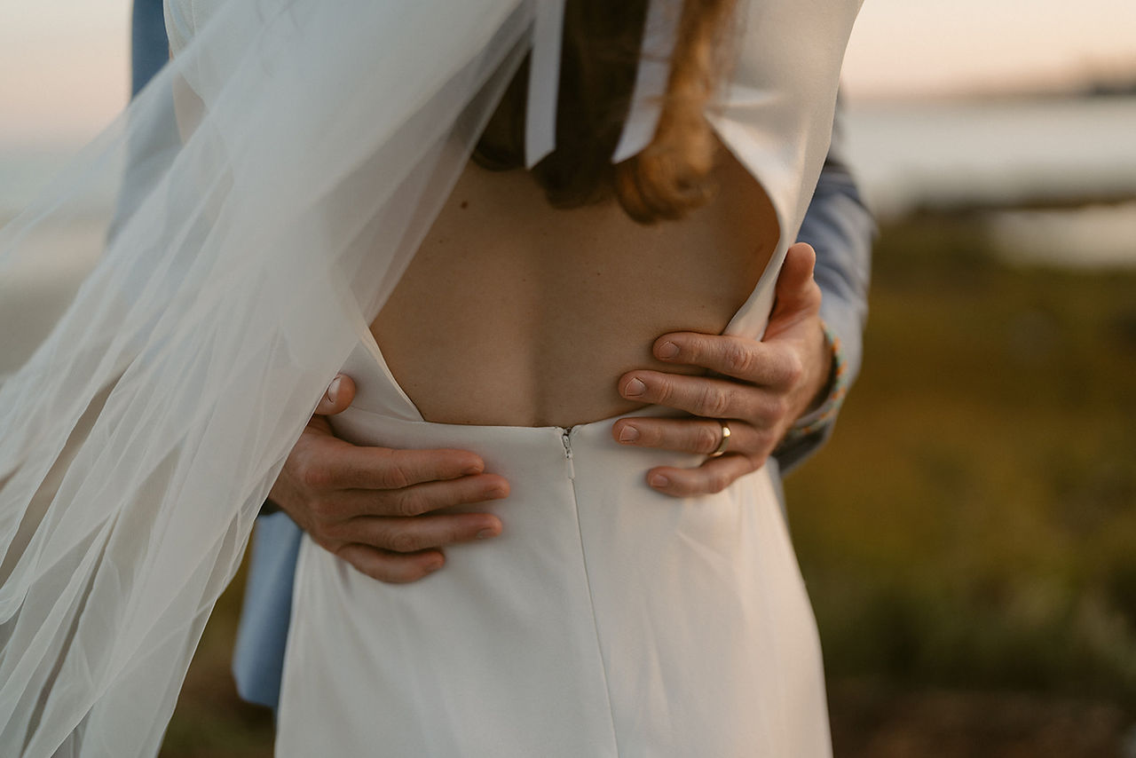 Couple exploring beach at sunset in Acadia for September Elopement day