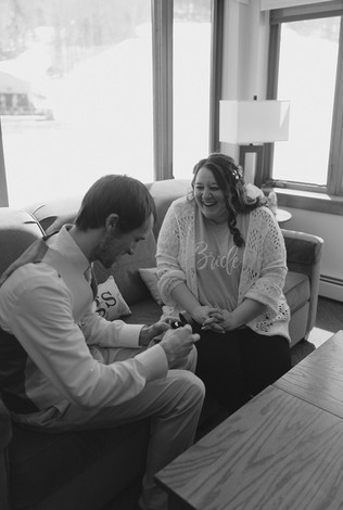 Couple sharing gift on loon mountain elopement day