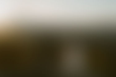 White Mountains Adventure Elopement Couple enjoying sunrise at first look on a mountain