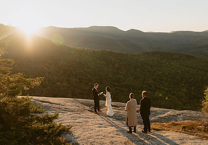 new hampshire elopement couple exchanging vows at sunrise on a mountain in the white mountains national forest