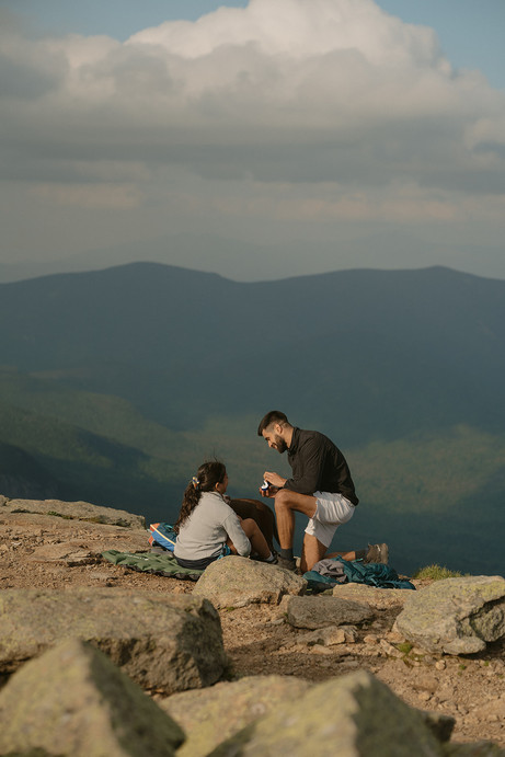 franconia ridge proposal couple on mountain top in nh in white mountains on mount lafayette proposing with dog