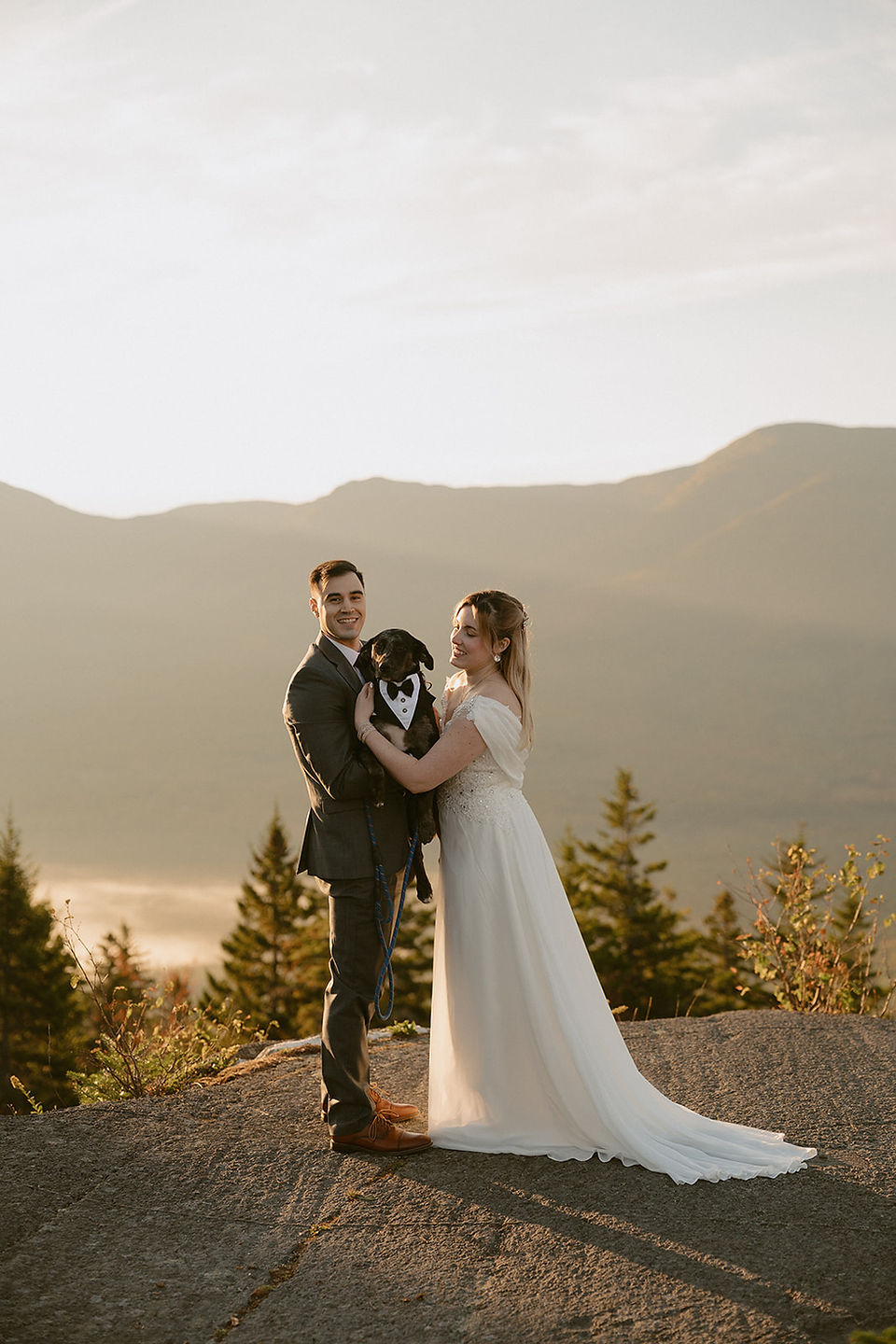Pinkham notch sunrise elopement couple enjoying view of mountains from summit on elopement day