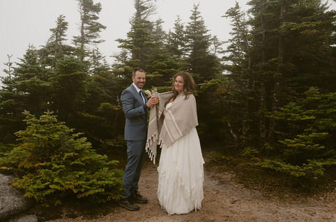 couple celebrating on a mountain for mount Osceola elopement day