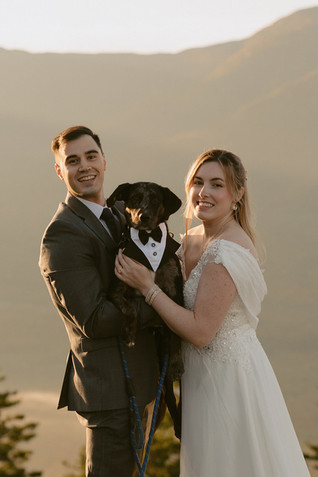Pinkham notch sunrise elopement couple enjoying view of mountains from summit on elopement day