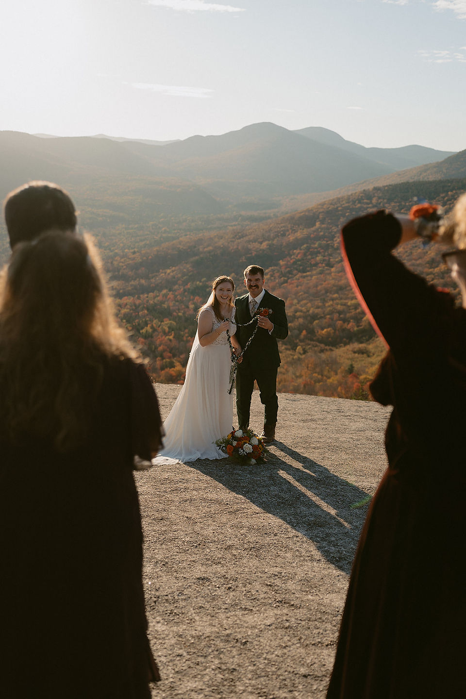 White Mountains Micro Wedding with family on a mountain top at sunrise in the fall
