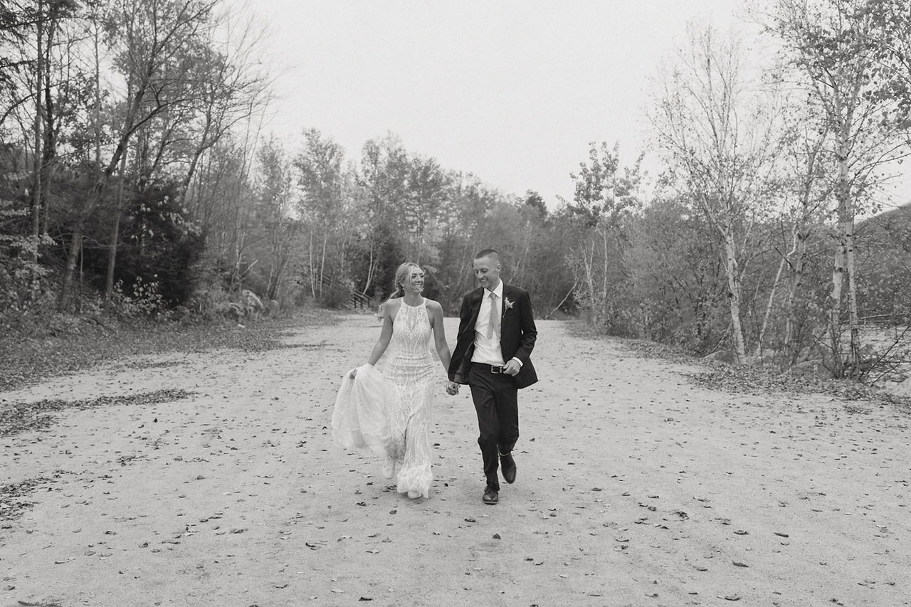 kancamagus highway elopement bride and groom exploring the kanc