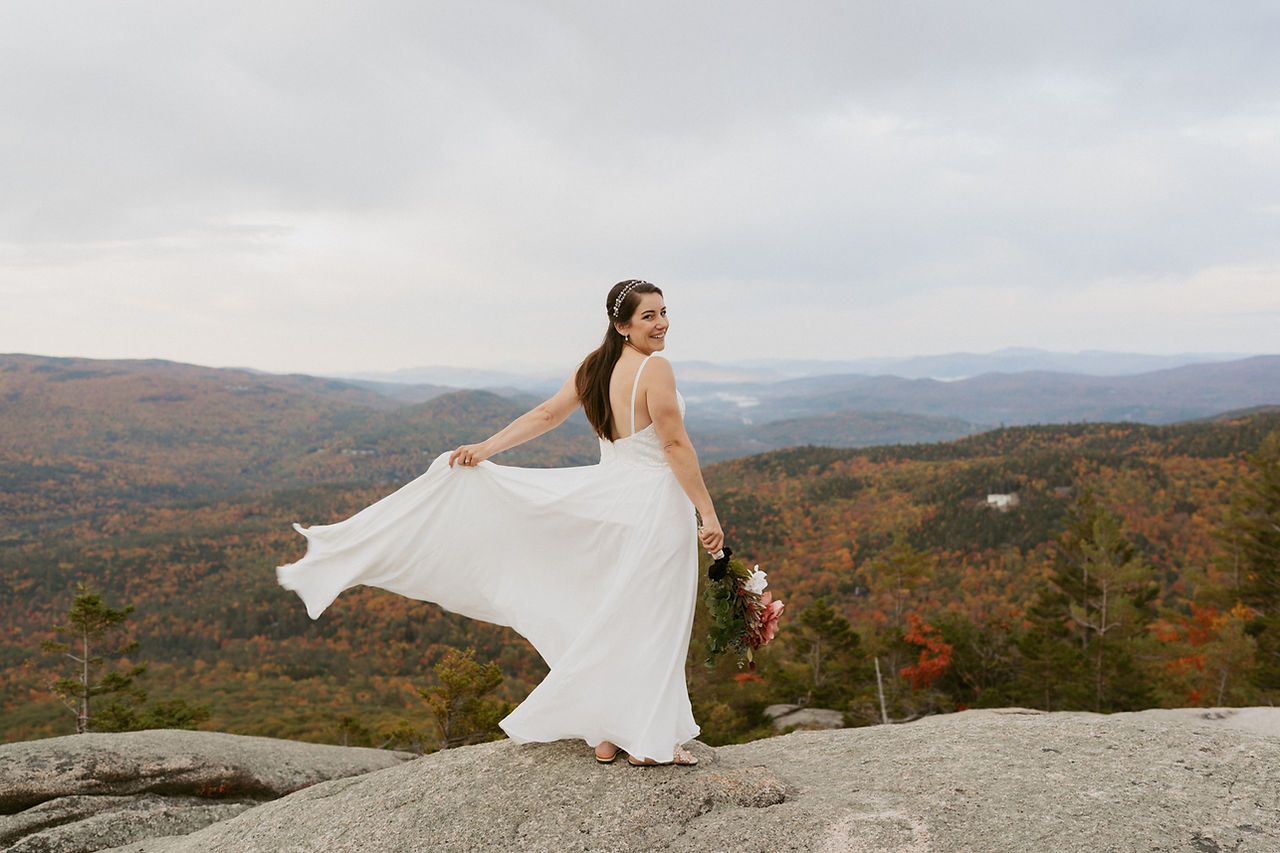 Franconia Notch Fall Elopement couple on mountain top in white mountains
