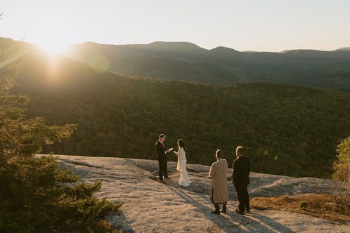 couple during ceremony for waterville valley elopement at sunrise