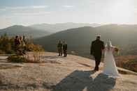 White Mountains Micro Wedding with family on a mountain top at sunrise in the fall bride waking to ceremony with dad on a mountain